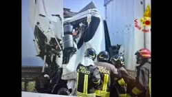 Serious highway accident, truck driver pulled alive from the wreckage by firefighters